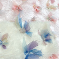 Tejido de poliéster bordado bowknot sintético sintético tela de piel